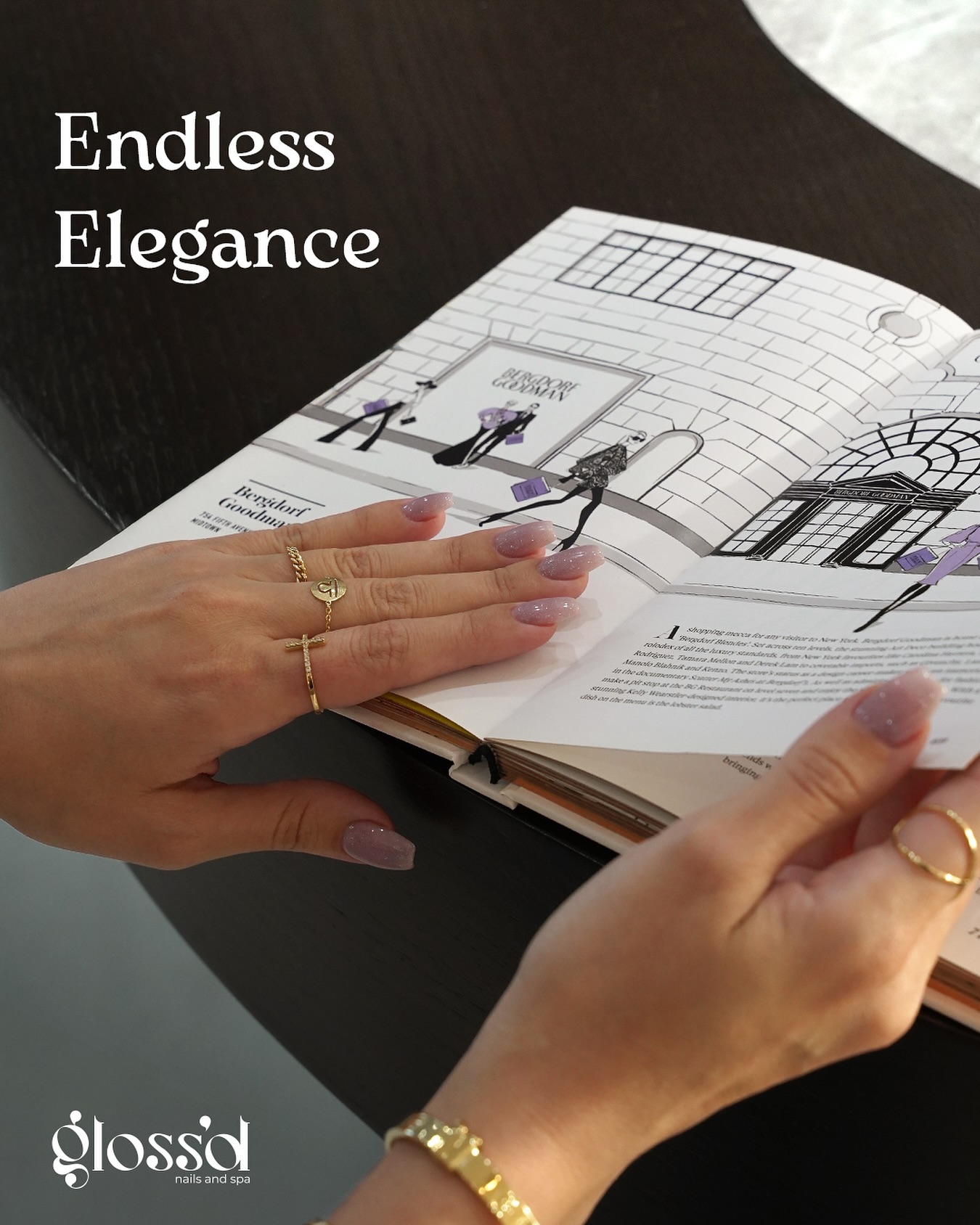 Hands reviewing luxury nail design options in a manicure lookbook during beauty content production