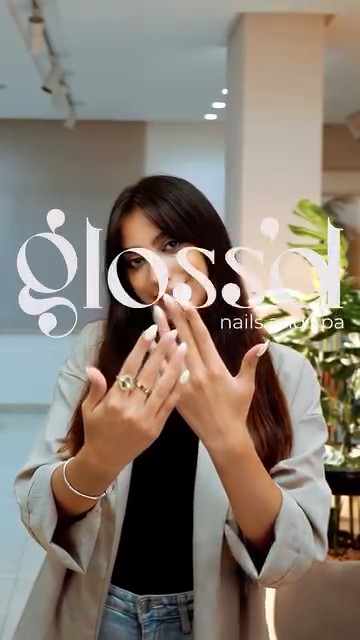 Woman showing her finished manicure at Glossd nail salon in beauty content production